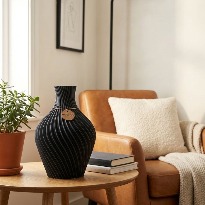 Aro vase in Charcoal Black on a side table